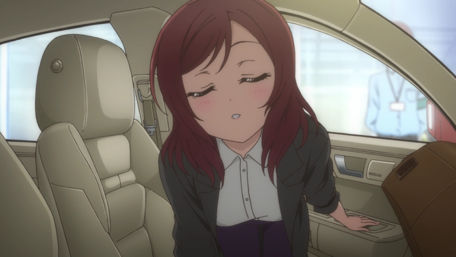 Maki Nishikino leaning in for a kiss before exiting her car.