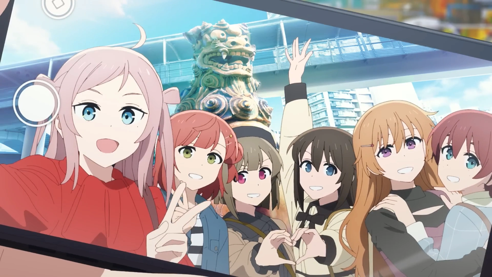 Lanzhu Zhong taking a selfie with Ayumu Uehara who is behind her, Kasumi Nakasu and Shizuku Osaka who are making a heart, and Kanata Konoe and Emma Verde embracing each other.